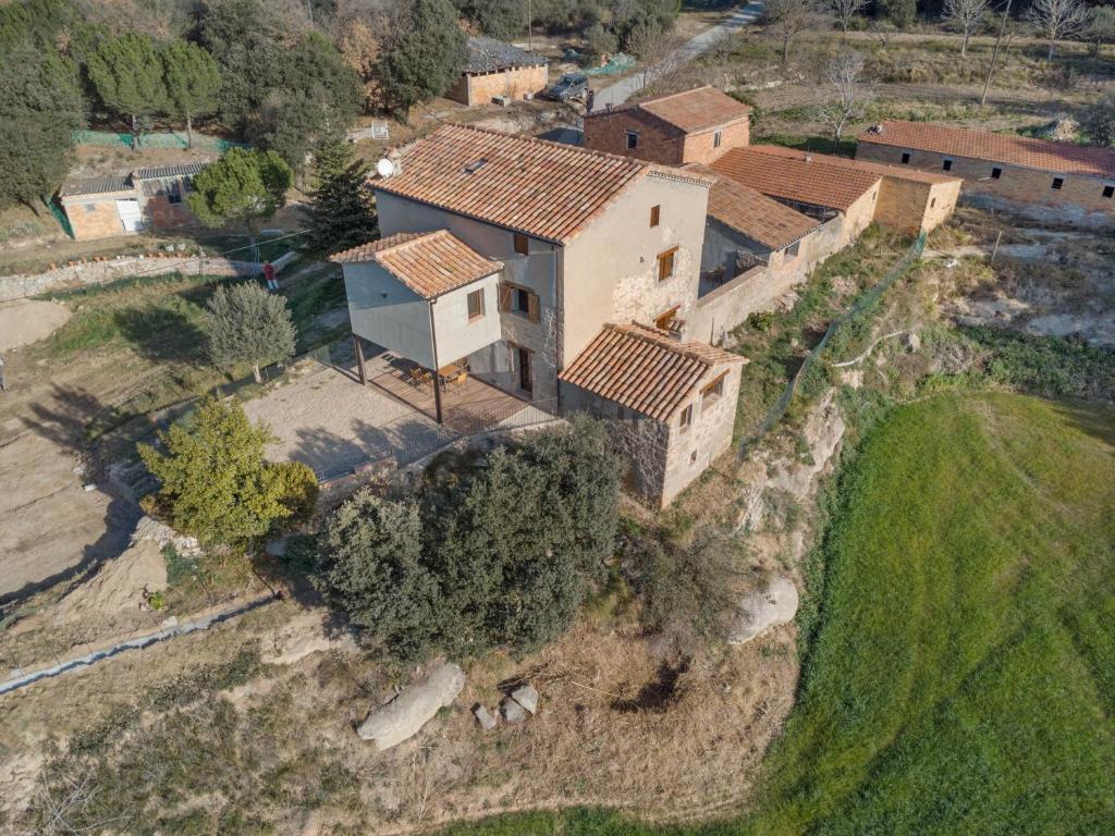 an aerial view of a house on a hill at Cal Trumfet in Caserras