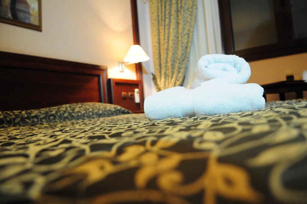 Postel nebo postele na pokoji v ubytování Avalon Airport Hotel Thessaloniki