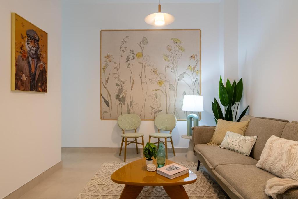a living room with a couch and a table at Iberos Home in Seville