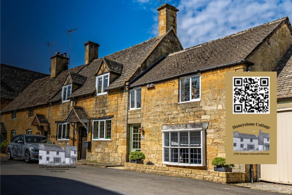 an old stone building with a sign in front of it at Honeystone Cottage Stanton near Broadway in Stanton