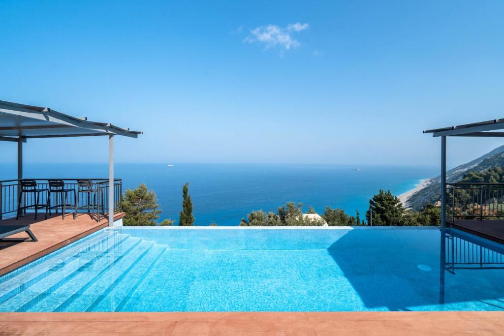 a swimming pool with a view of the ocean at Villa sea view 1 in Athanion