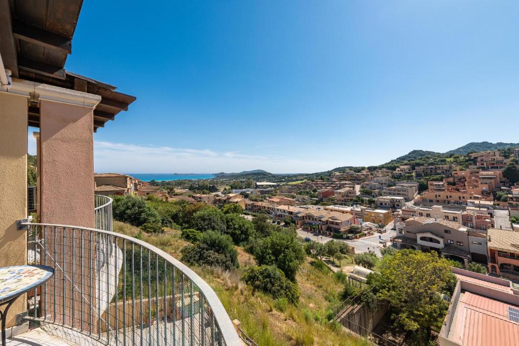 a view of a city from a balcony of a house at Luxury Apartment Simius in Villasimius