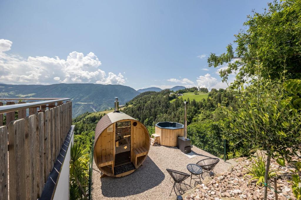 a wooden boat sitting on top of a balcony at Thalerhof Sancta Sebastianus in Auna di Sotto