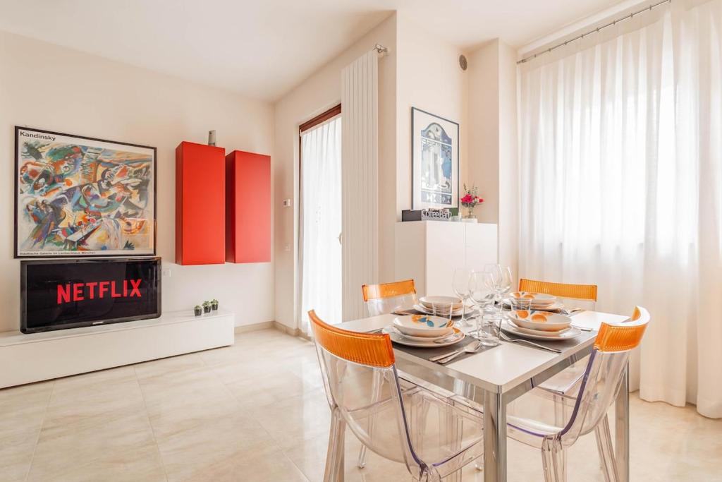 a dining room with a glass table and chairs at Matera Castle Suite in Matera