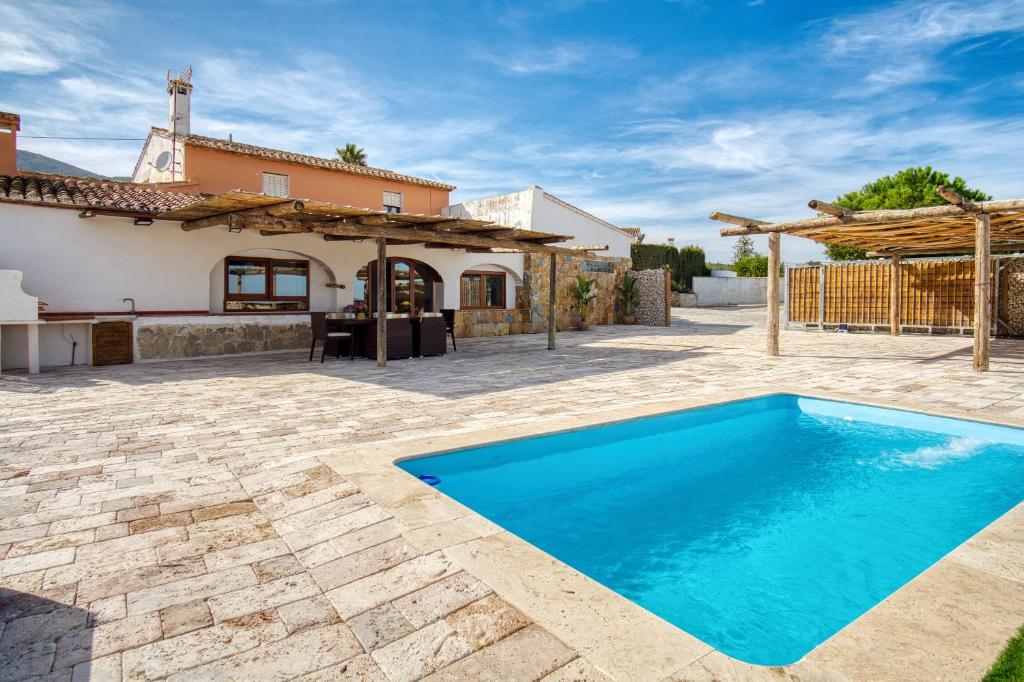 an image of a villa with a swimming pool at Casa Stone in Benissa