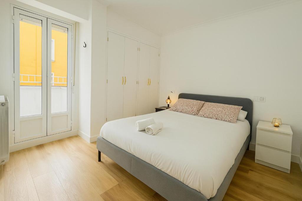 Postel nebo postele na pokoji v ubytování Leña II - by Wehomes - Pleno centro