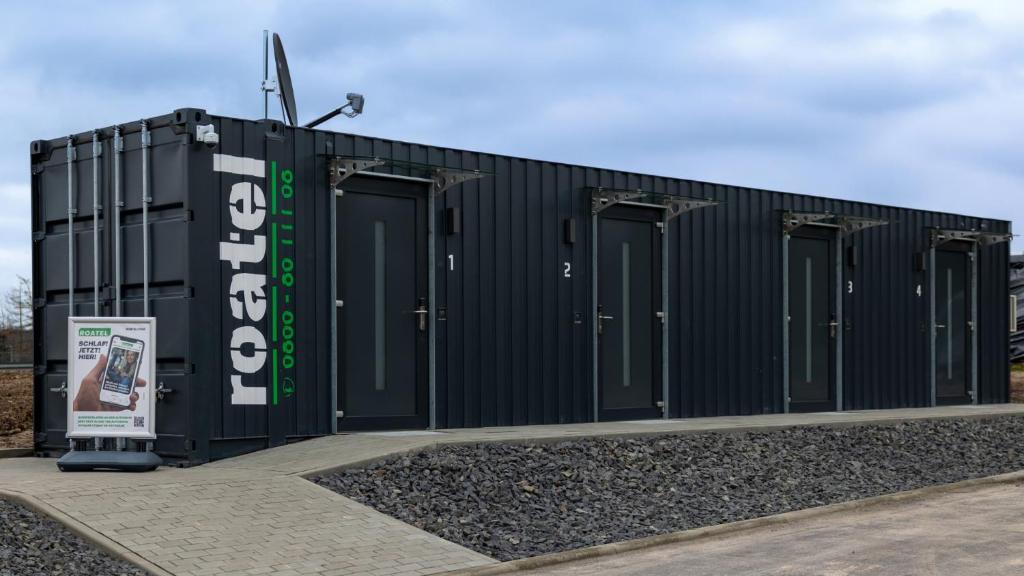 a black building with many doors on it at Roatel Staufenberg-Lutterberg A7 my-roatel-com in Staufenberg