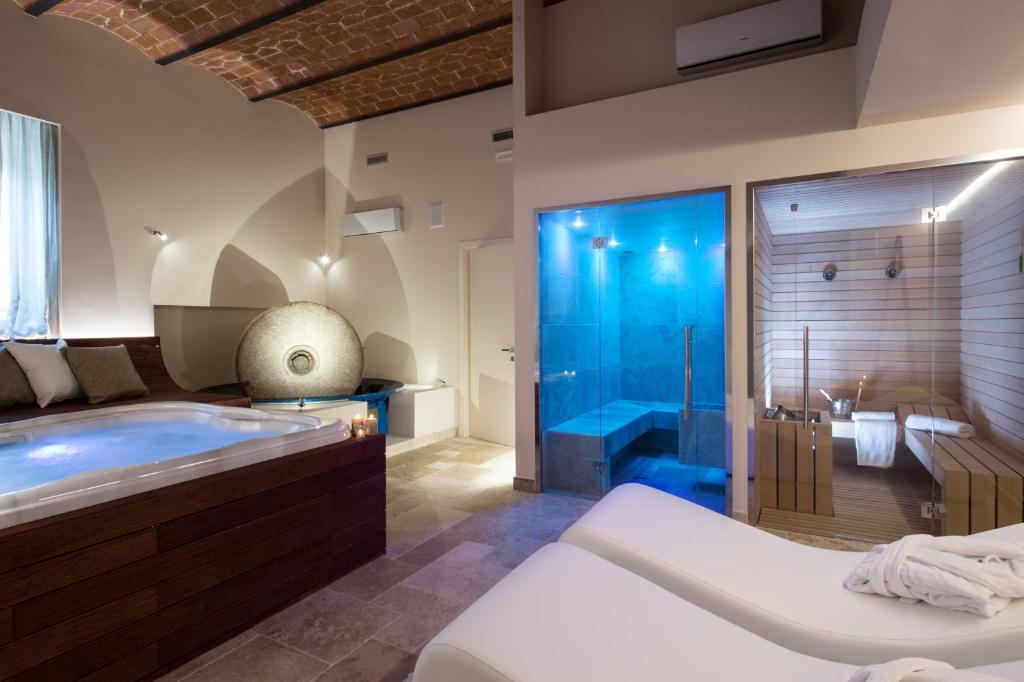 Postel nebo postele na pokoji v ubytování Agriresort & Spa Fattoria I Ricci
