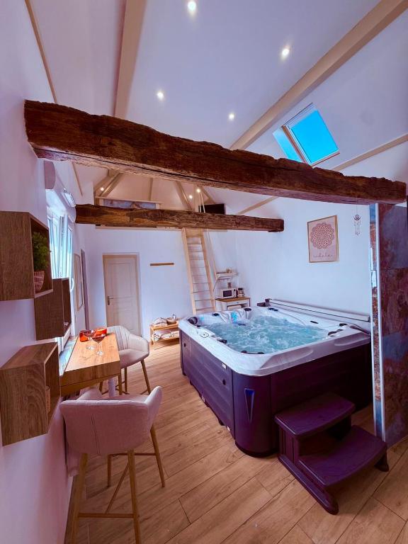 a large room with a large hot tub at La Mezzanine - Chambre avec Spa in Bellaing