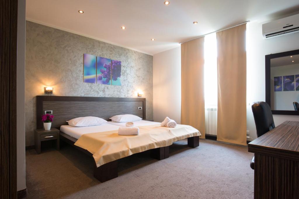 Postel nebo postele na pokoji v ubytování Villa Mystique