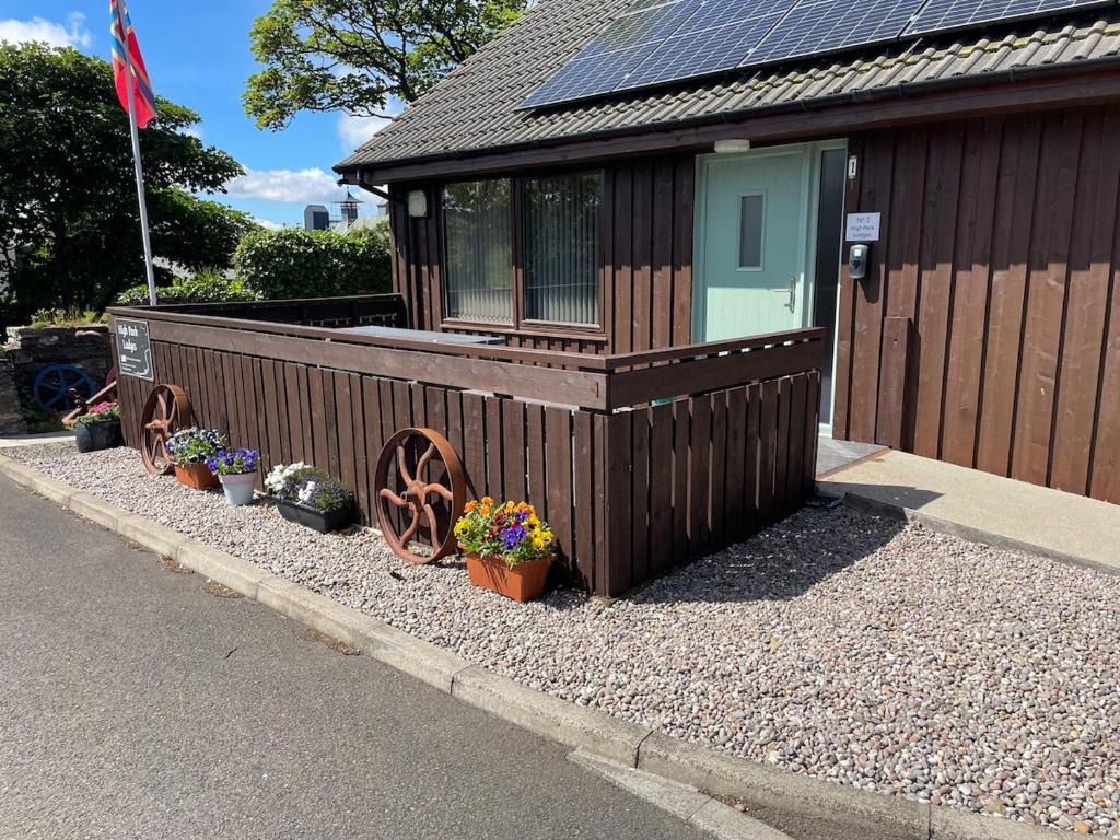 a small building with plants in front of it at No 1 High Park Lodges in Orkney
