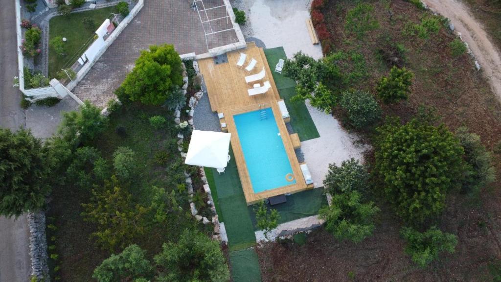 an overhead view of a house with a swimming pool at Trullo Vito with pool in Martina Franca