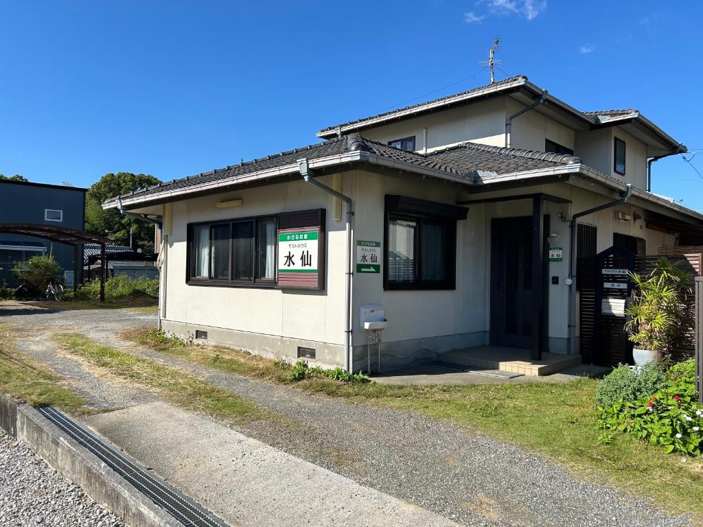 a small house on the side of a road at Guesthouse Suisennosato in Konan