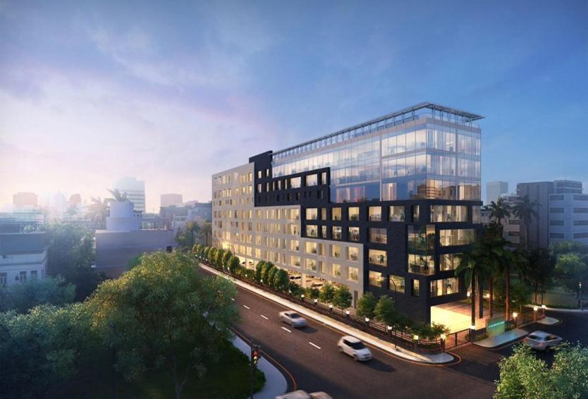 a rendering of a tall building with a street at Zone by The Park New Market Kolkata in Kolkata