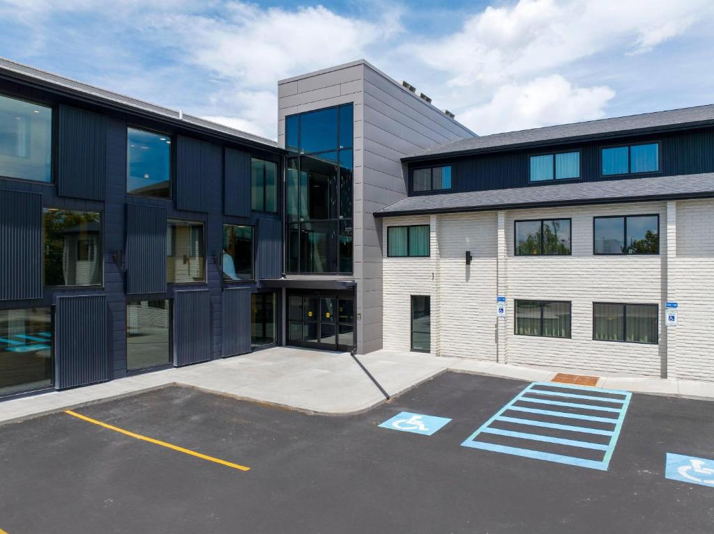 an empty parking lot in front of a building at The Gibson Hotel Great Falls, an Ascend Collection Hotel in Great Falls