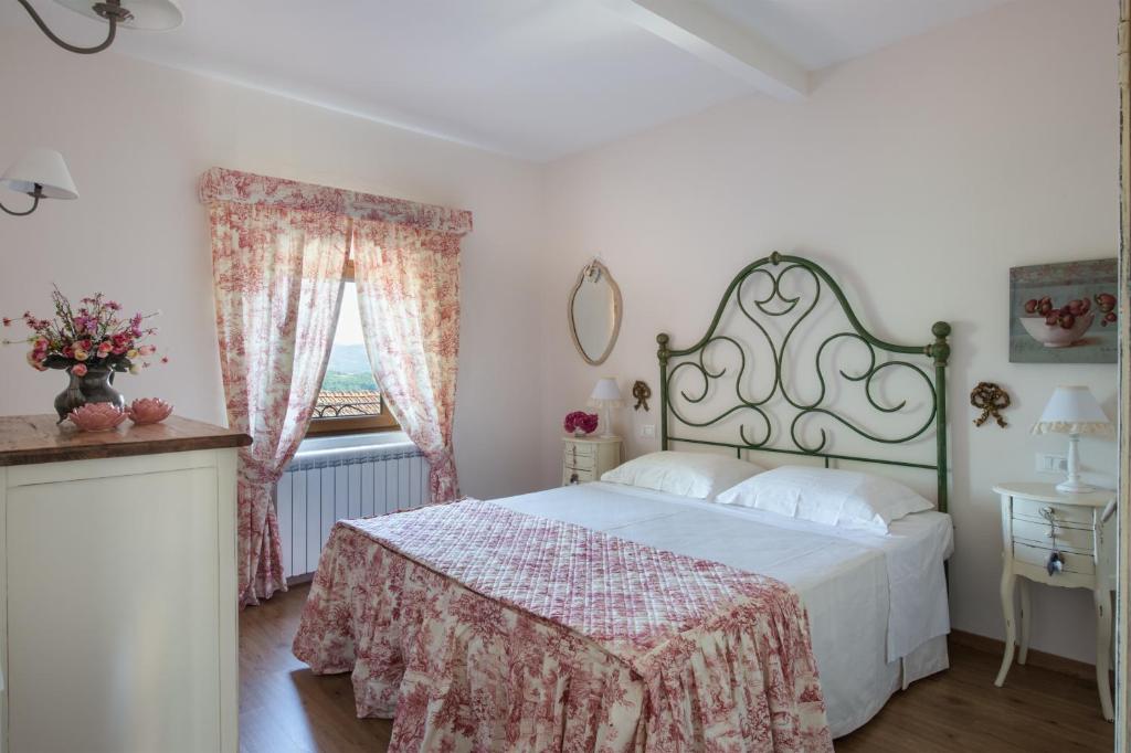 Postel nebo postele na pokoji v ubytování Agriresort & Spa Fattoria I Ricci