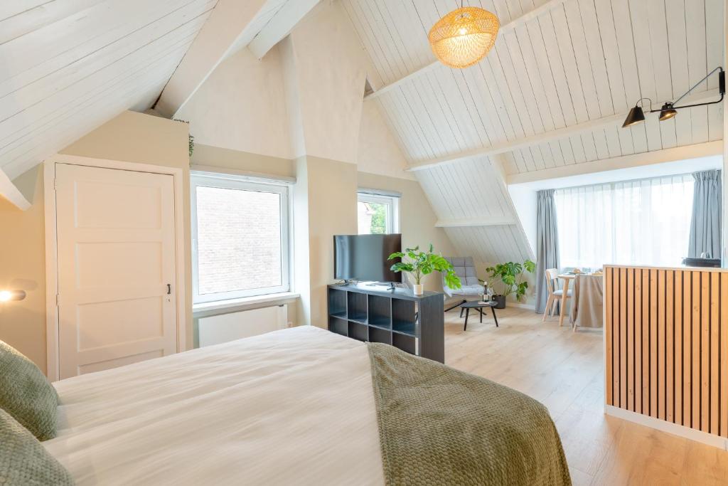 Ένα ή περισσότερα κρεβάτια σε δωμάτιο στο Wijngaardstraat 5A