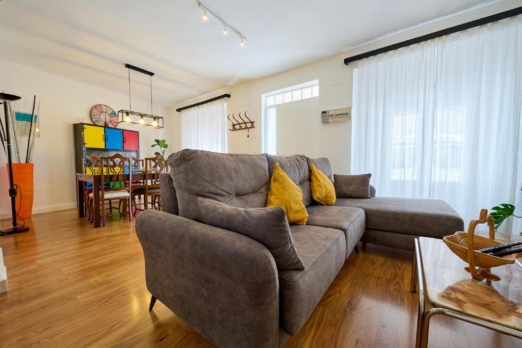 a living room with a couch and a table at El Caminito, CasaRural en Torredelcampo in Torre del Campo