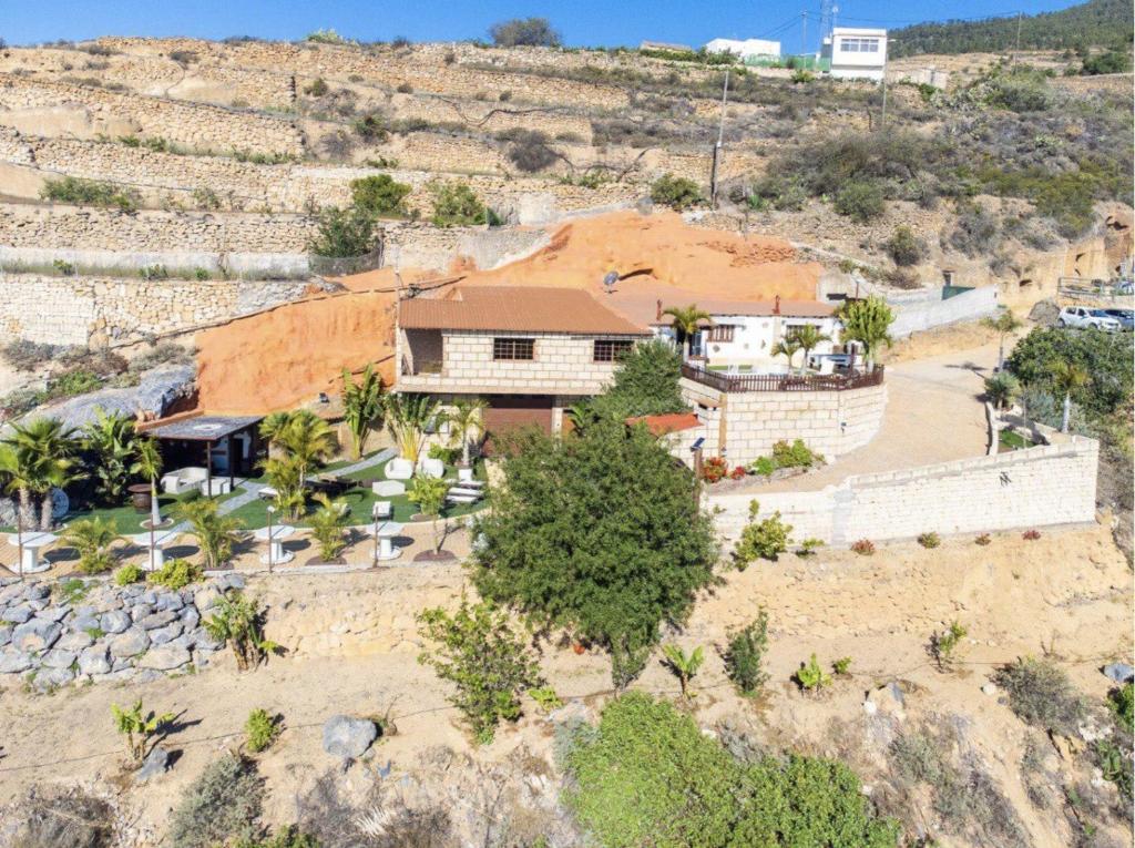 an aerial view of a house on a hill at Arico Cave Experience in Arico