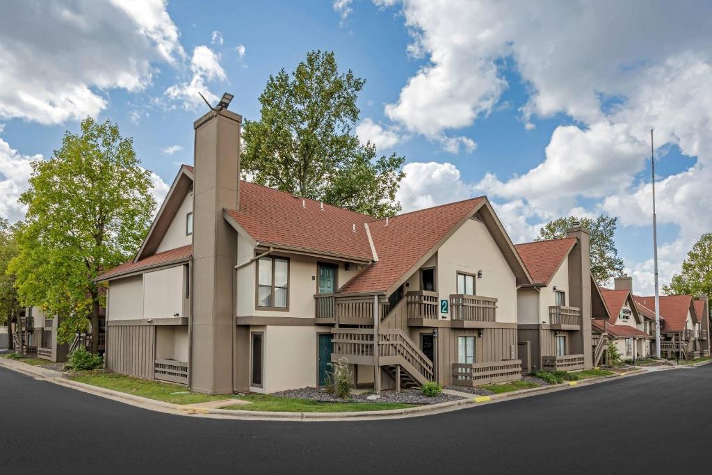 a rendering of a house on a street at MainStay Suites Springfield South - Battlefield Rd in Springfield