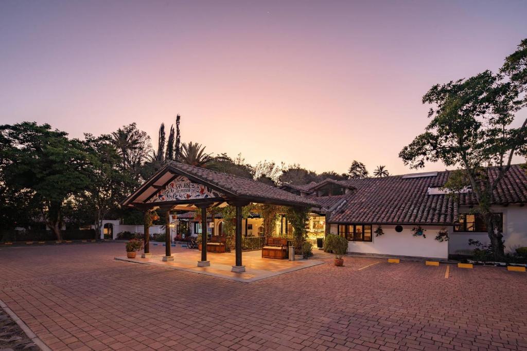 a building with a pavilion on a brick road at San Jose de Puembo Quito Airport, an Ascend Collection Hotel in Puembo