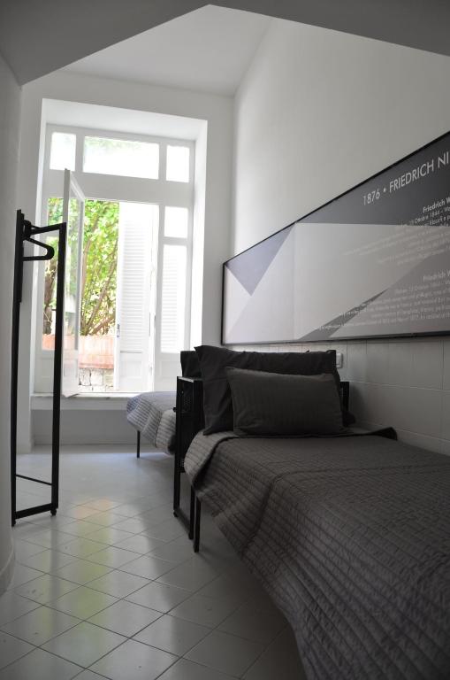 Postel nebo postele na pokoji v ubytování Muta House