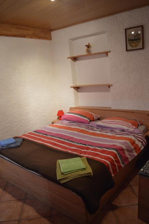 Postel nebo postele na pokoji v ubytování Jelenov breg pod Matajurem