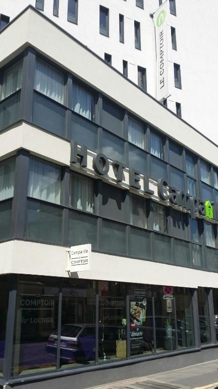 a building with a large sign on top of it at Campanile Nancy Centre - Gare in Nancy