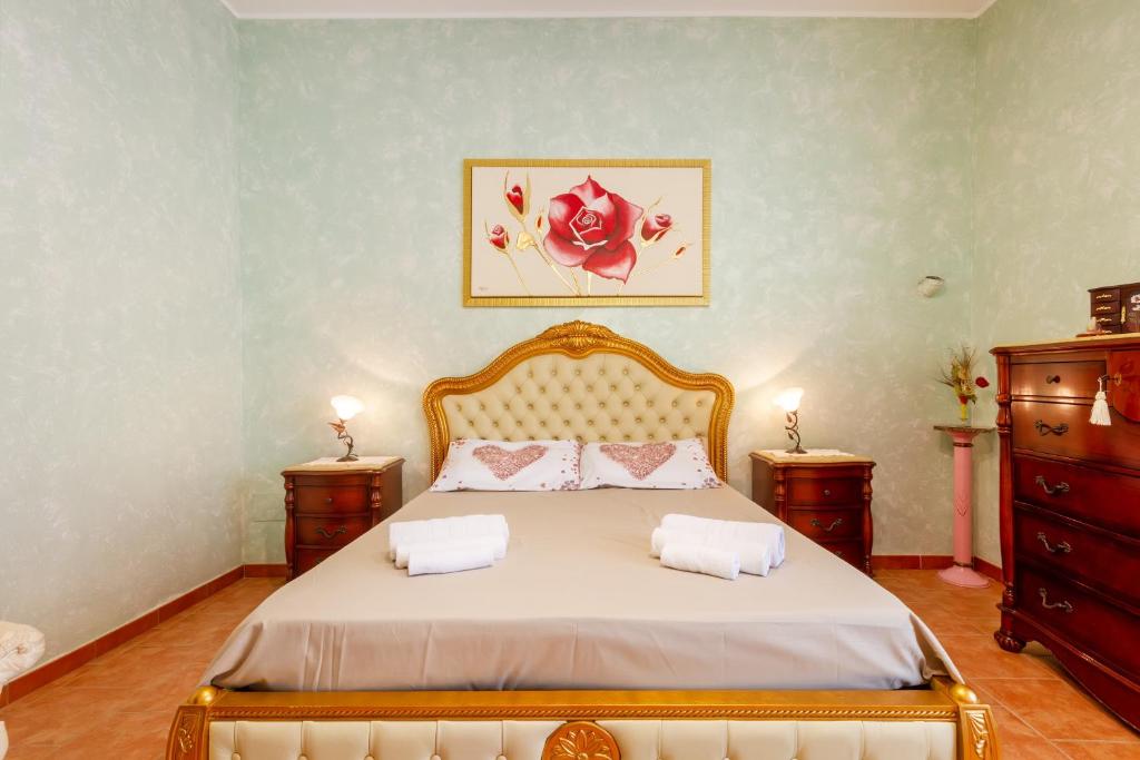 En eller flere senge i et værelse på Villa Acquamarina