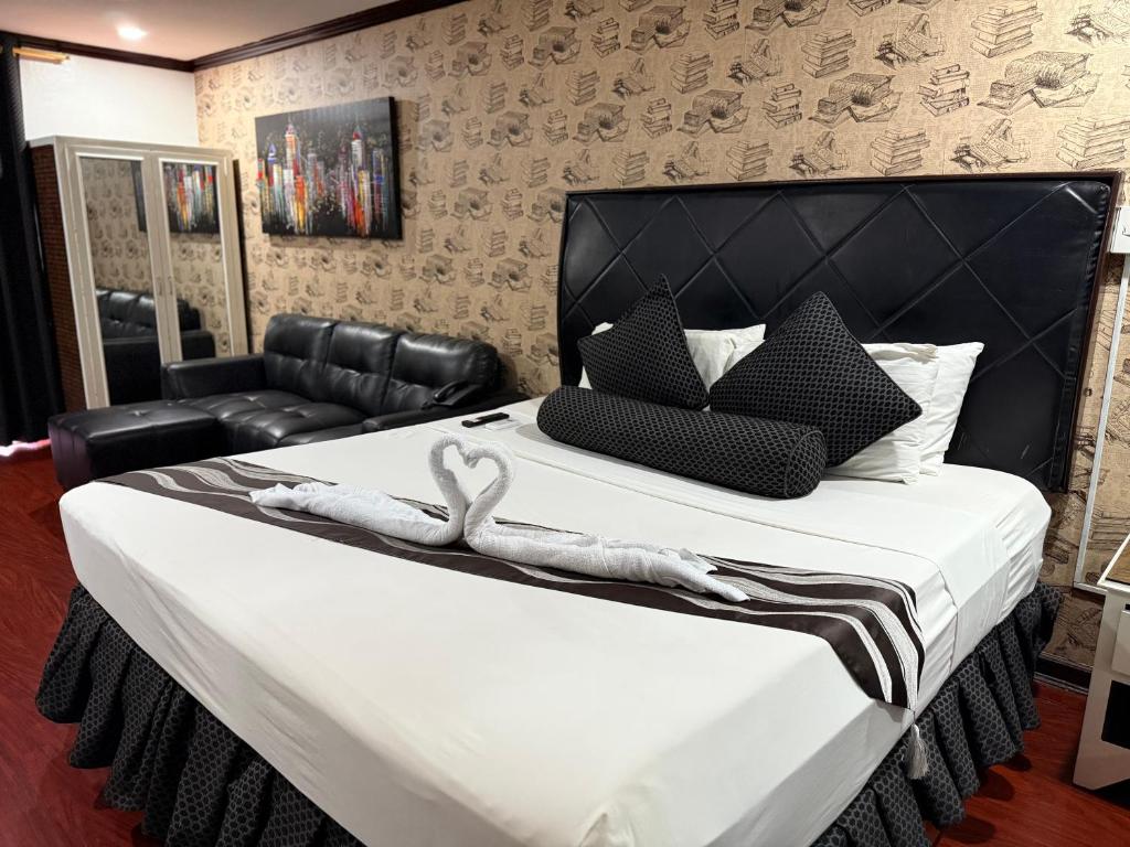 En eller flere senge i et værelse på Grand Central Hotel