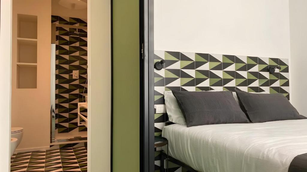 Ένα ή περισσότερα κρεβάτια σε δωμάτιο στο Deluxe Apartments in via Toledo