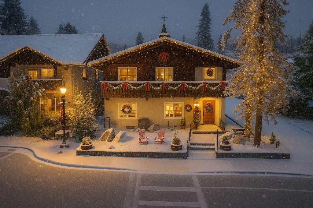 a house with a christmas display in the snow at Snowcreek Birch - Hot Tub - 8 People in Leavenworth