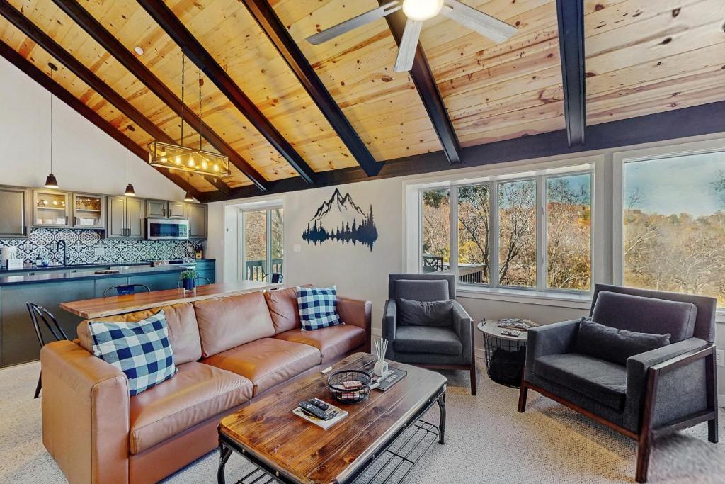 a living room with a couch and a table at The Glen C10 in Sugar Mountain