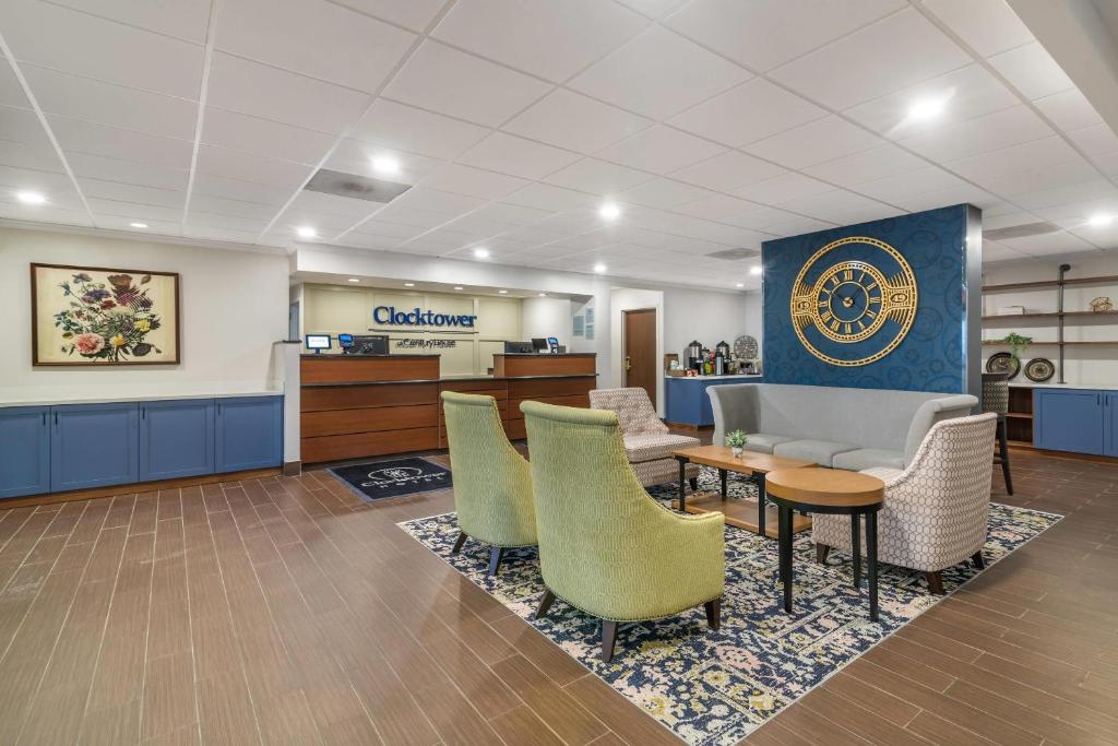 a waiting area of a hospital with chairs and a table at The Clocktower Hotel Latham - North Albany, an Ascend Collection Hotel in Cohoes