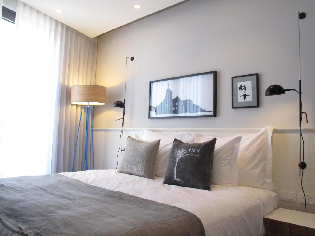 Postel nebo postele na pokoji v ubytování Bezalel Hotel - an Atlas Boutique Hotel