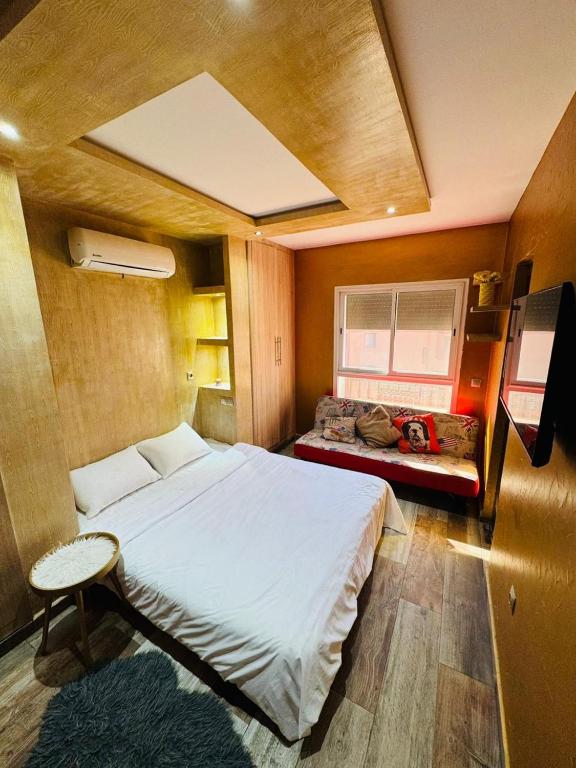 Ένα ή περισσότερα κρεβάτια σε δωμάτιο στο Appartement coup de coeur