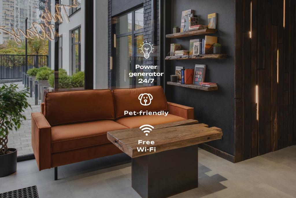 a brown leather couch sitting in front of a store at Lumen Living in Kyiv