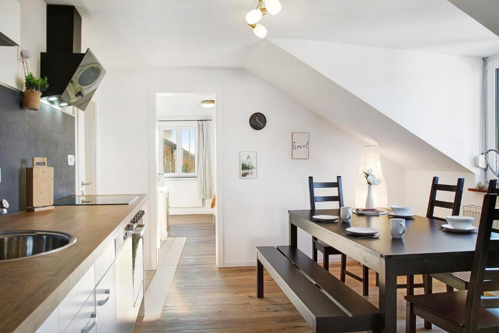 a kitchen and dining room with a table and chairs at Horst in Perach