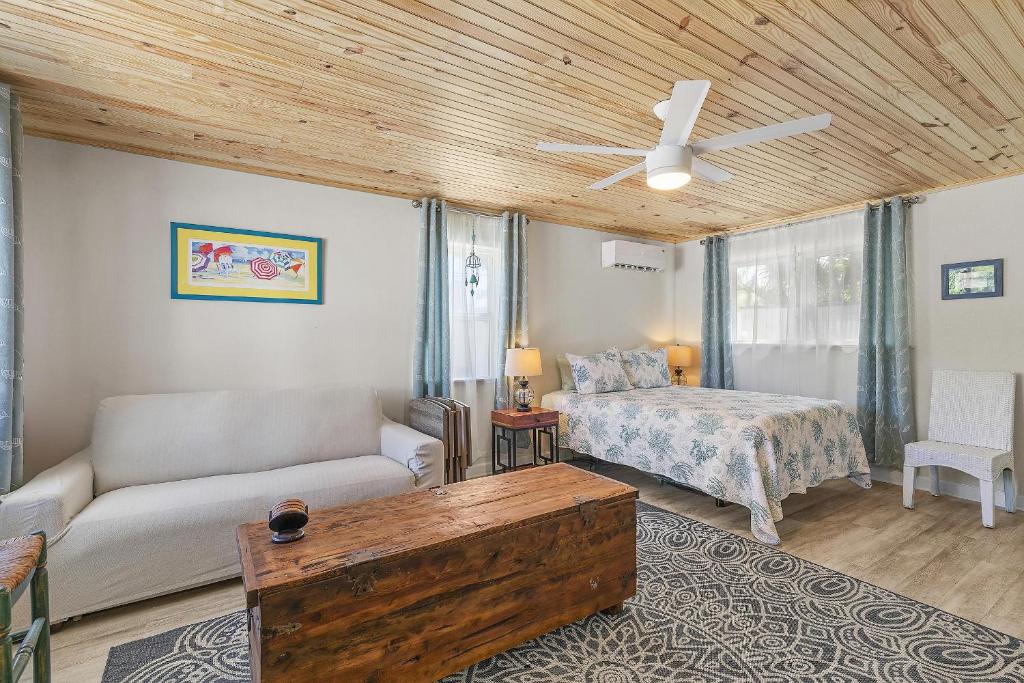 a living room with a couch and a bed at Terrapin Station I in Chicken Island
