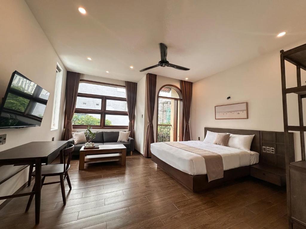 Ένα ή περισσότερα κρεβάτια σε δωμάτιο στο Picnic Day Danang