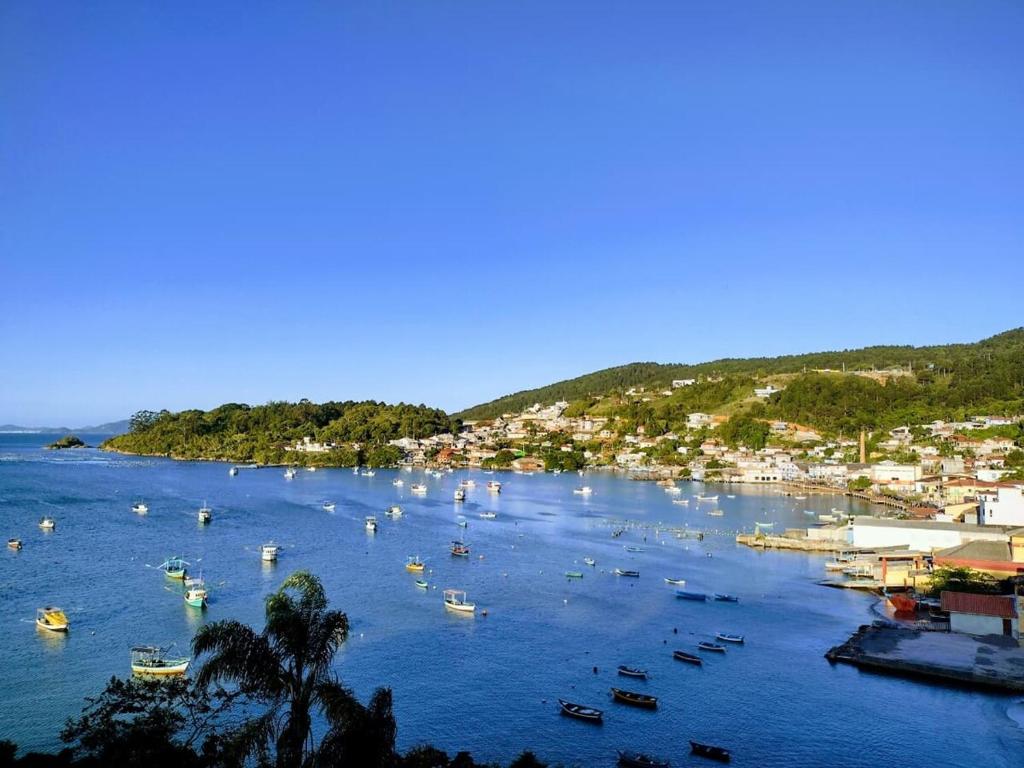 a group of boats in a large body of water at Casa Sol e Mar in Governador Celso Ramos