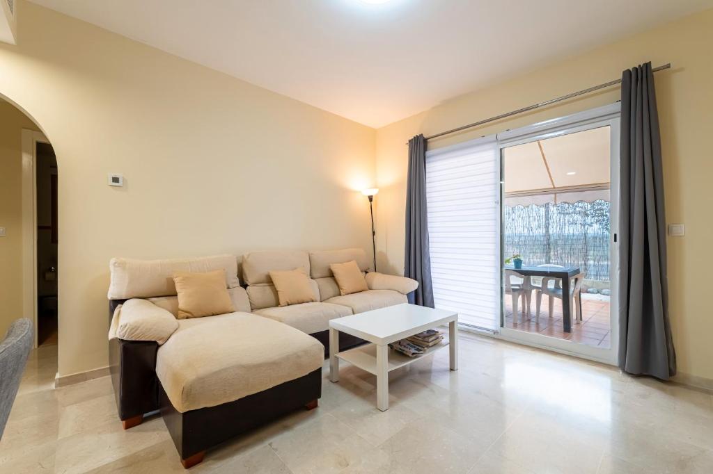 a living room with a couch and a table at Vista Hermosa in Ayamonte