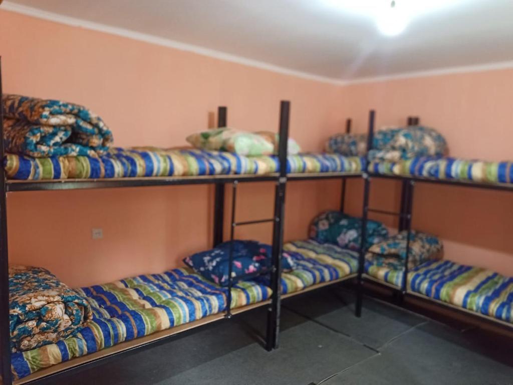 a room with four bunk beds in a room at River BPR Hostel in Tbilisi City