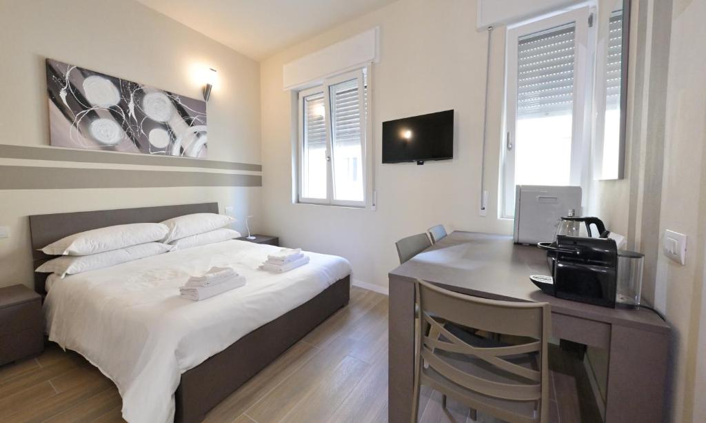 Postel nebo postele na pokoji v ubytování City Loft