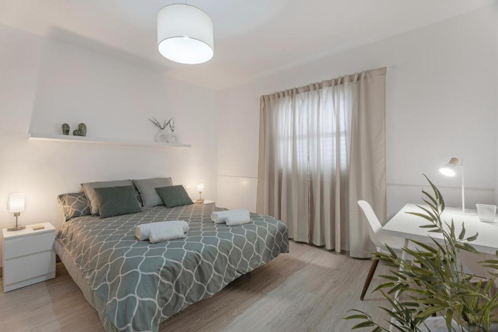 a bedroom with a bed with two pillows on it at Casa Calma ll in Tacoronte
