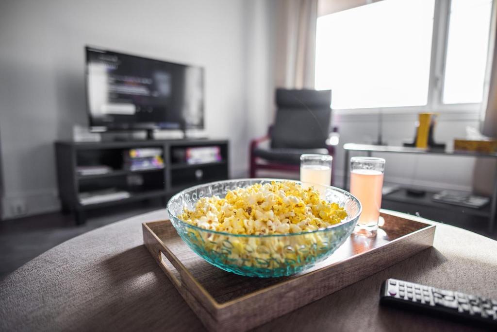 a bowl of rice and two glasses of beer on a table at Downtown - Rooftop patio - Free shuttle to ski Mountain in Mont-Tremblant