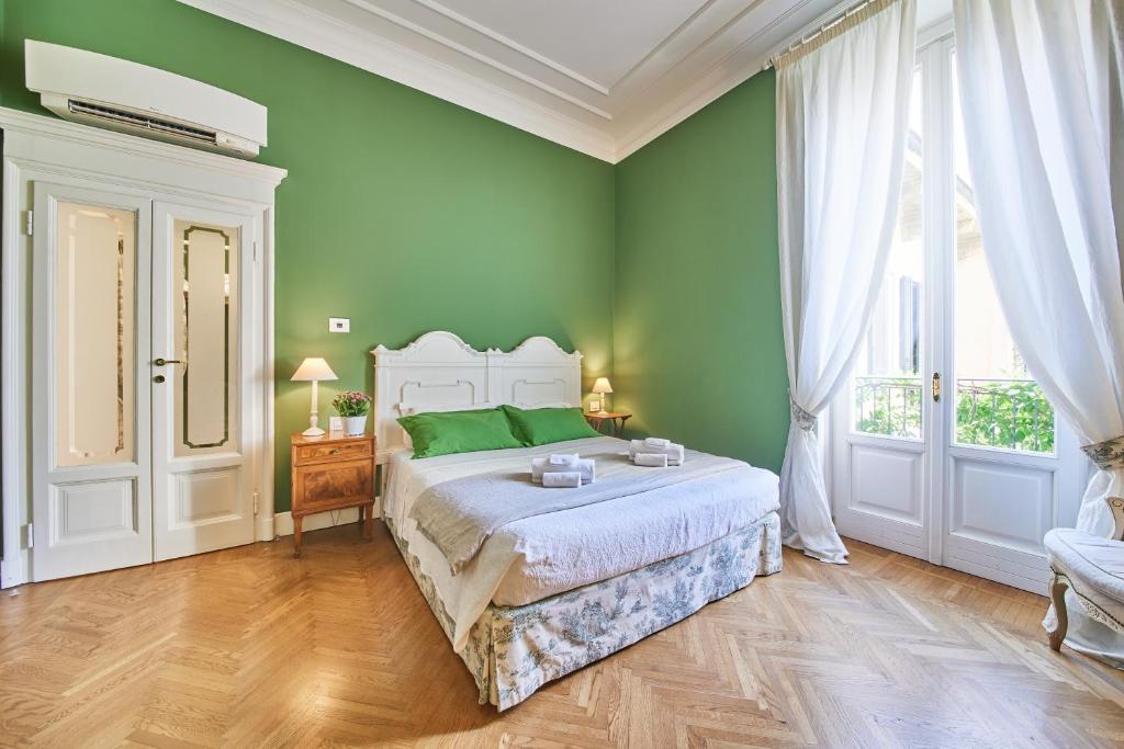 Ένα ή περισσότερα κρεβάτια σε δωμάτιο στο B&b La Foresteria