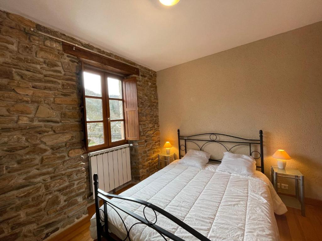 Postel nebo postele na pokoji v ubytování Les Buis