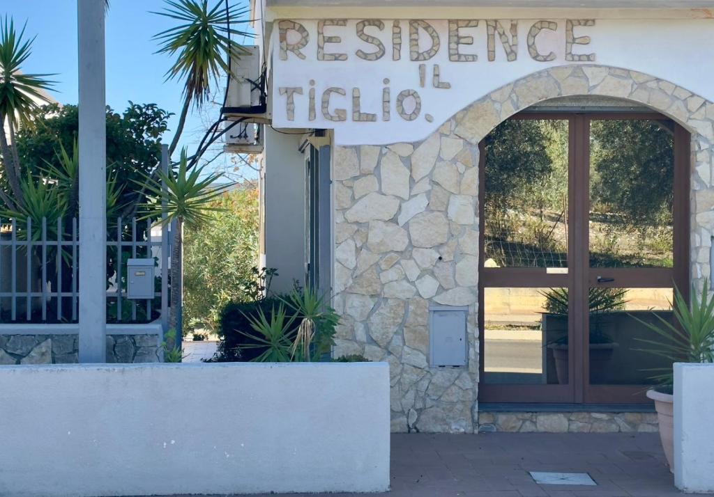 a entrance to a restaurant with a sign on the door at Tiglio Vieste in Vieste