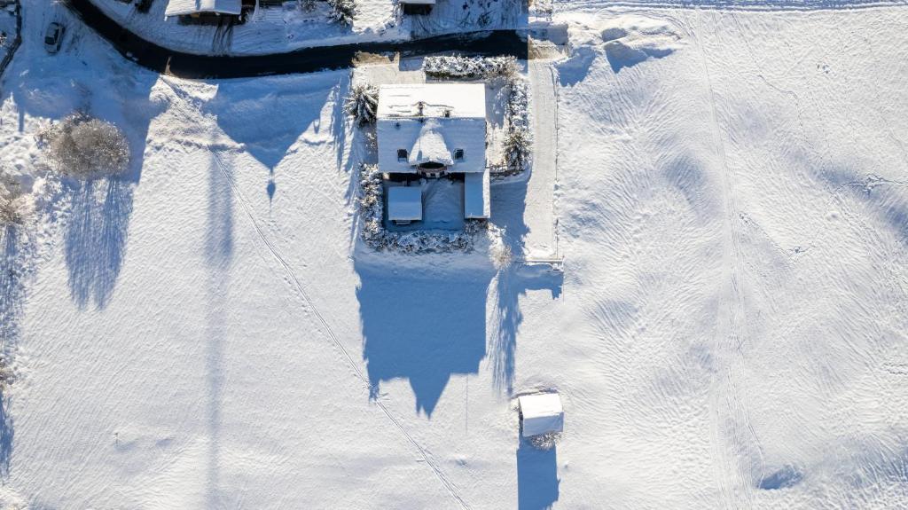 an aerial view of a house in the snow at ARLALPIN in Pettneu am Arlberg